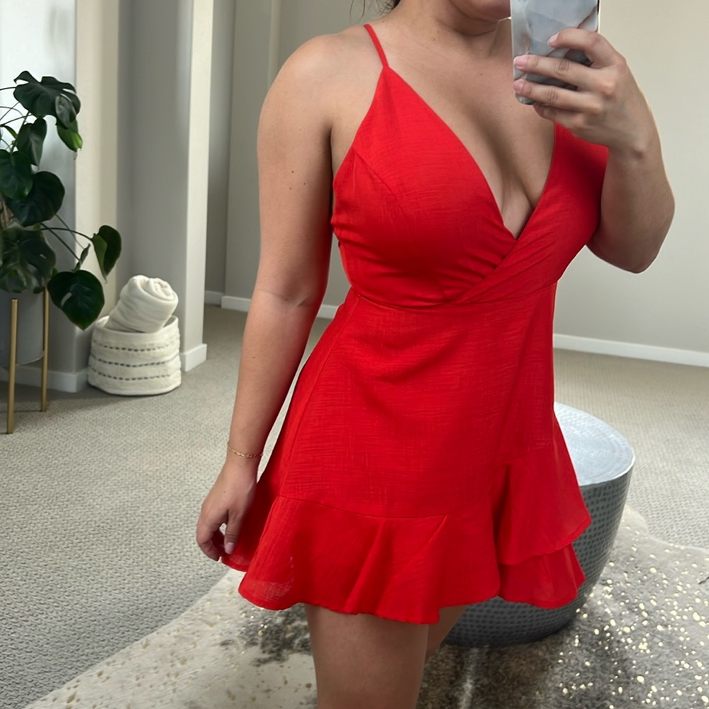 Stylish red mini romper with dress illusion